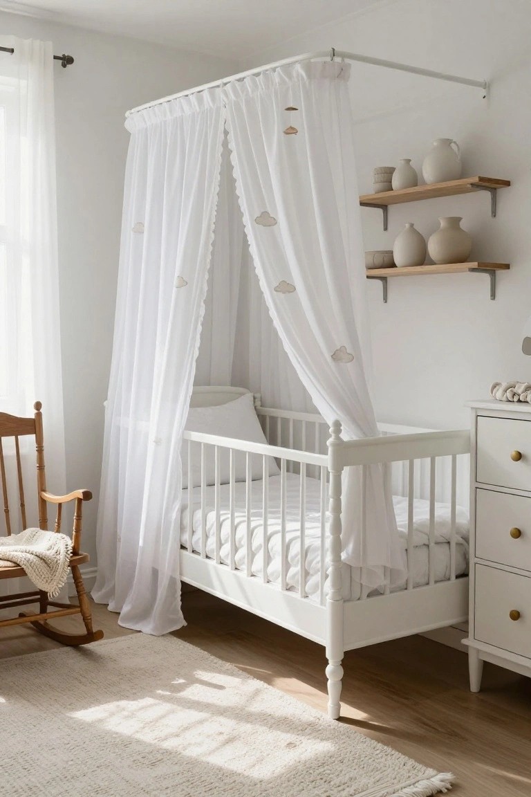 White wooden crib with sheer white canopy featuring embroidered clouds in a bright white nursery room that includes wooden floating shelves with beige pottery, a white dresser, and a wooden rocking chair on light wood floors.